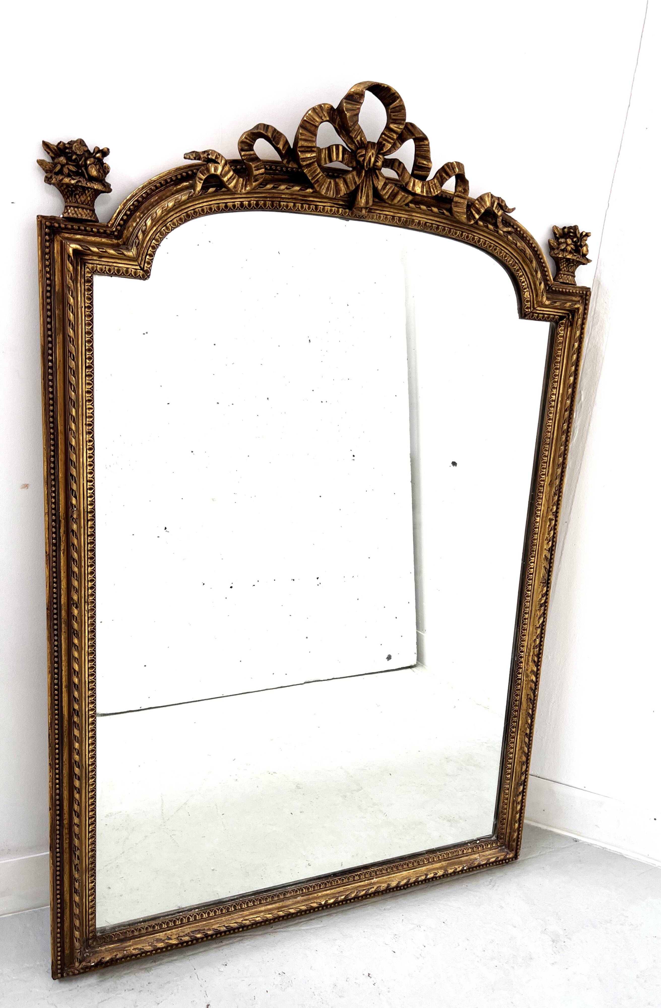 Louis XVI style mirror in wood and gilded stucco, 19th century