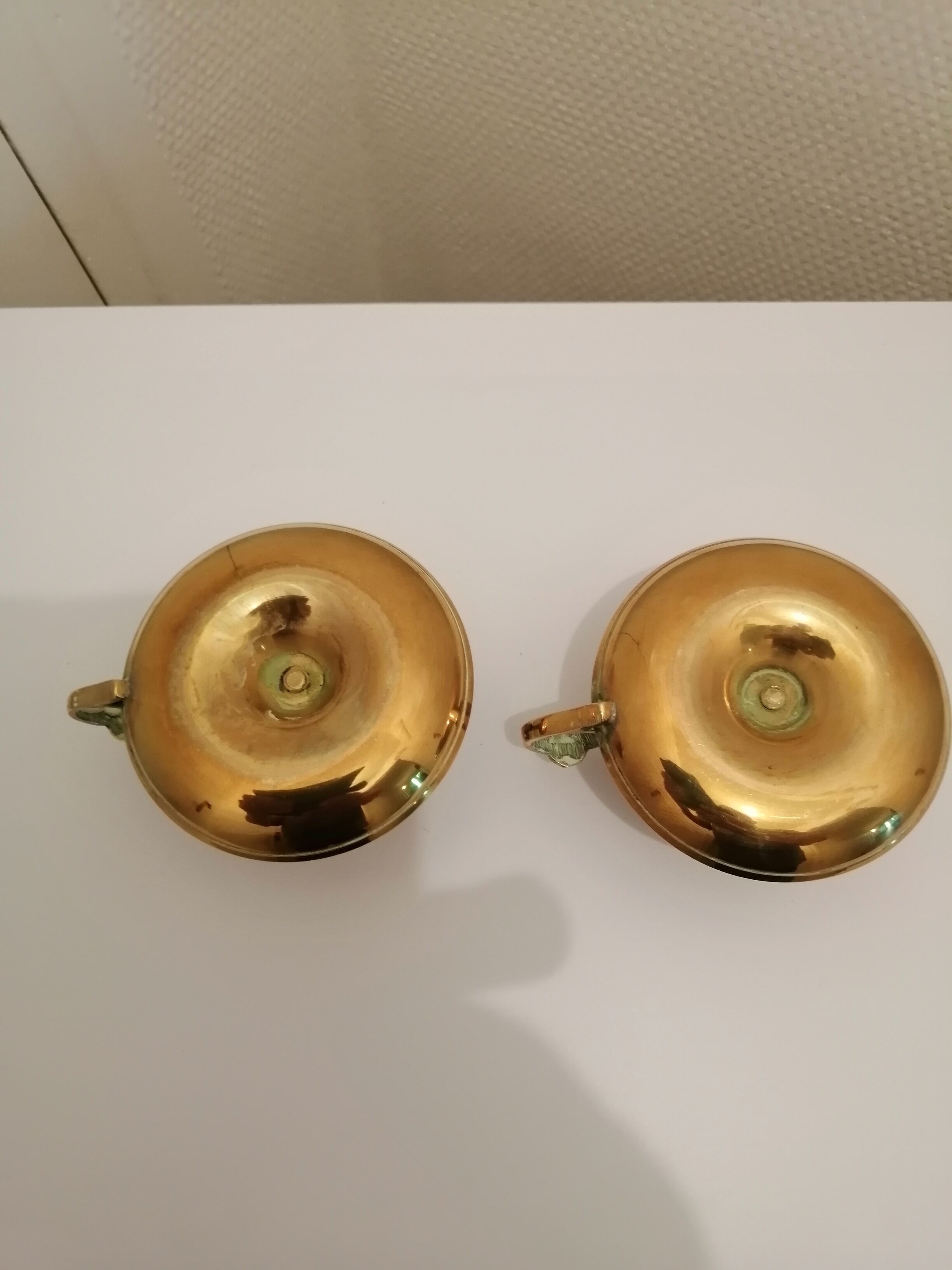 A PAIR OF SMALL COPPER CANDLE HOLDERS