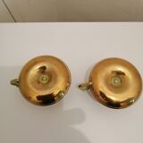 A PAIR OF SMALL COPPER CANDLE HOLDERS