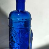 cobalt blue molded glass bottle in relief decoration bunches of grapes