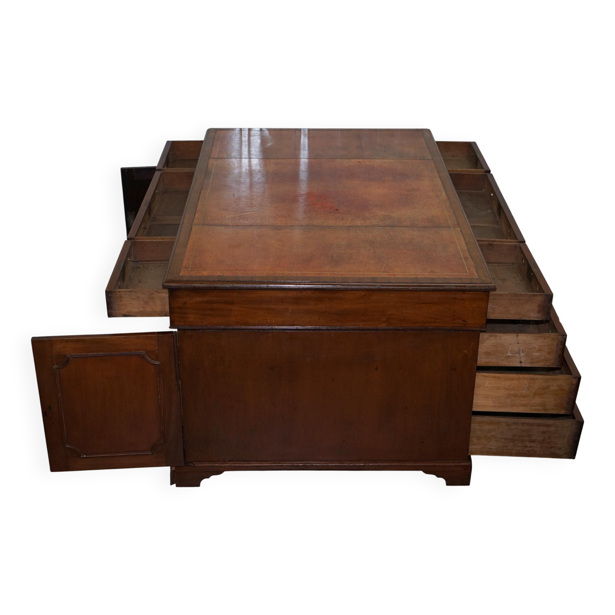 Double-sided partner's desk in walnut, George III, circa 1780, with lion head handles.