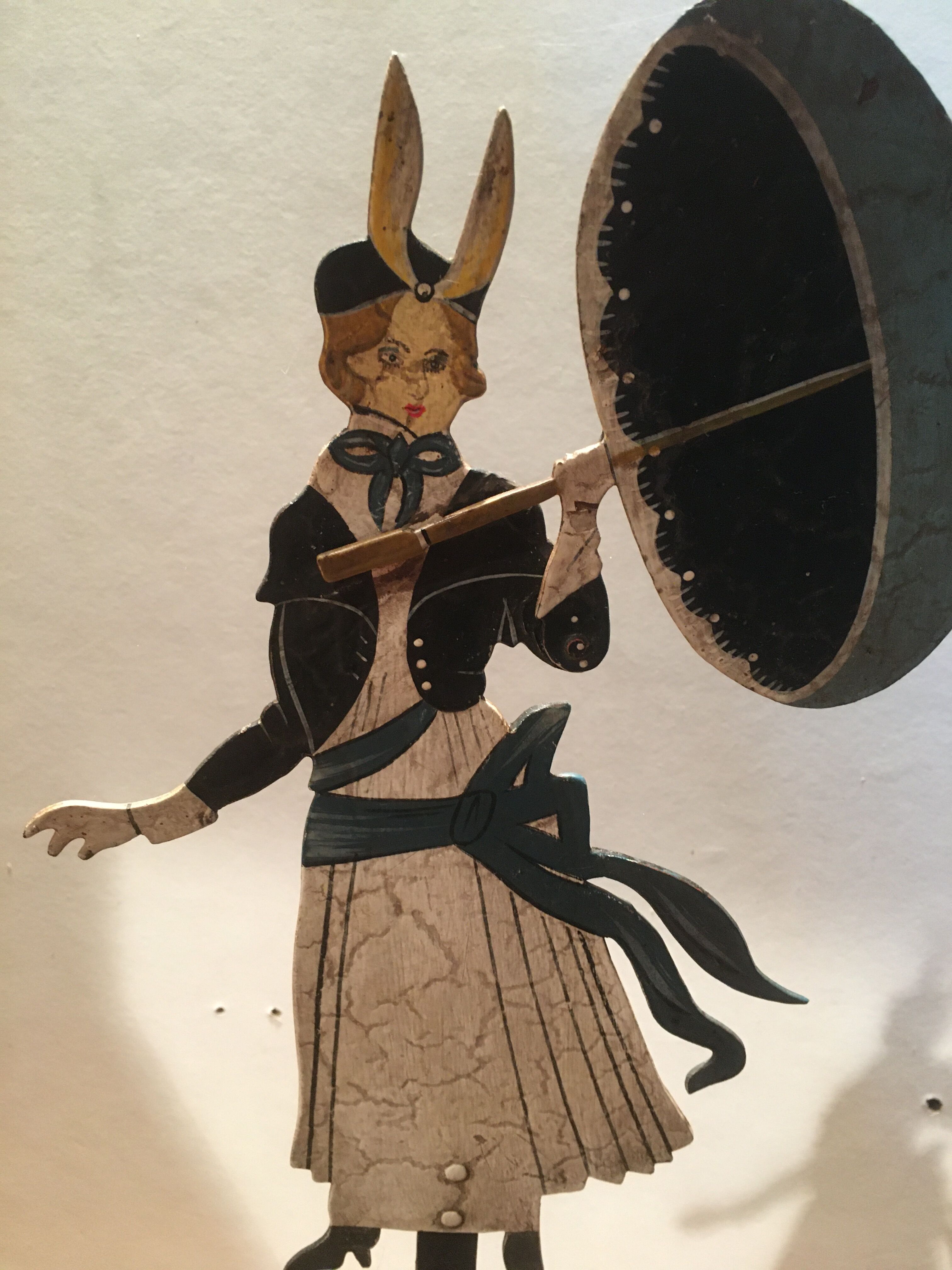 Woman with metal umbrella, pendulum