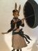 Woman with metal umbrella, pendulum
