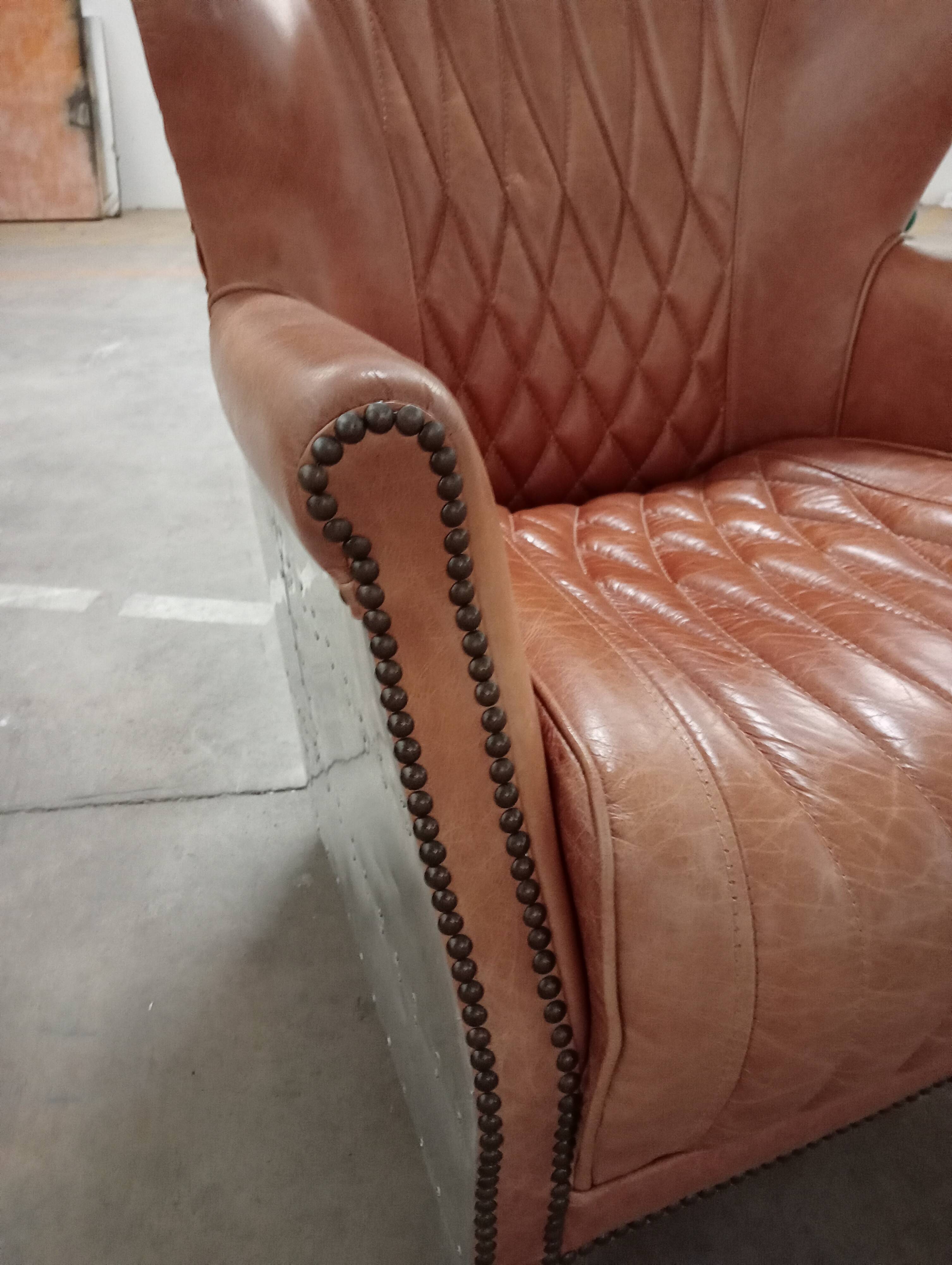 2 aviator armchairs