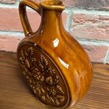 German round vase with floral motif, ornamental brown ceramic jug with handle