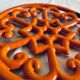 Dessous de plat en fonte orange