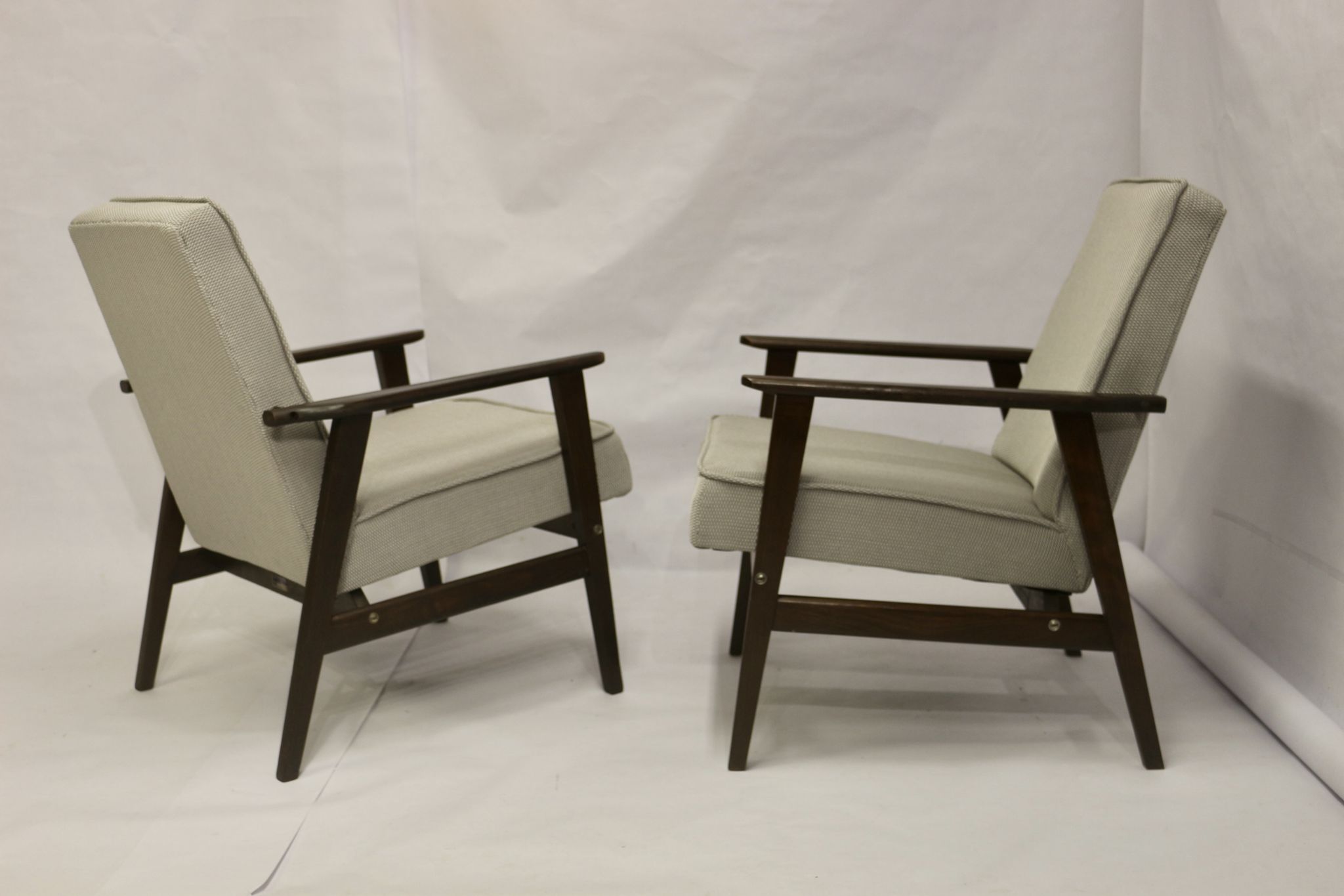 Pair of Henryk Lis armchairs 300-190s 1970s reupholstered gray textured fabric.