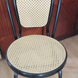 Chair in natural rattan and black metal
