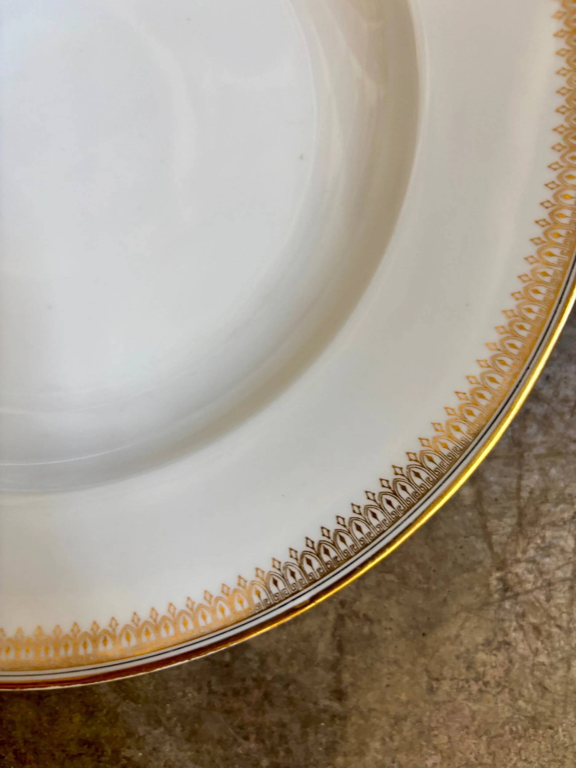 Gold monogrammed porcelain deep plate "F"