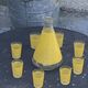 Liqueur service composed of a glass carafe and 8 small yellow screen-printed glasses