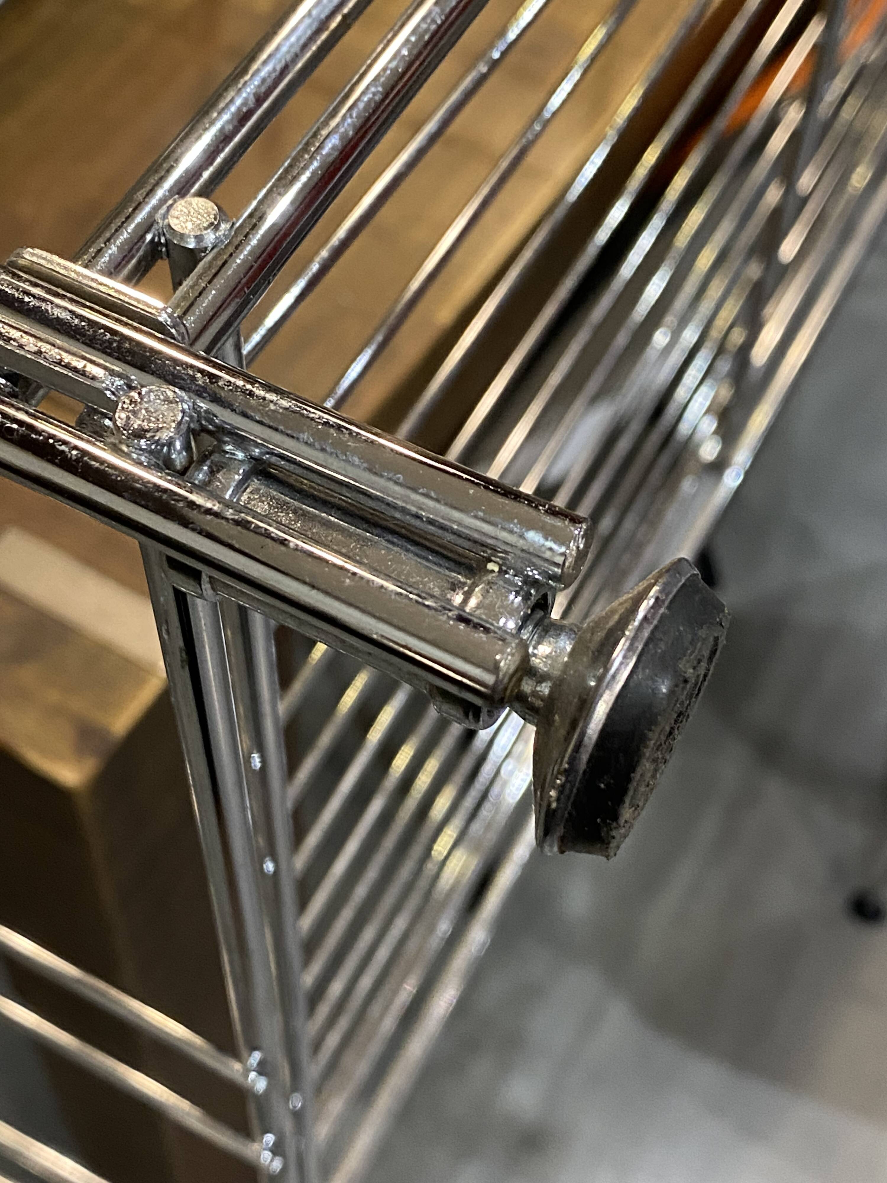 Modular wall bookshelf desk in vintage chrome.