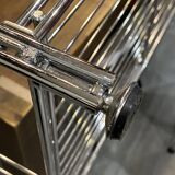 Modular wall bookshelf desk in vintage chrome.