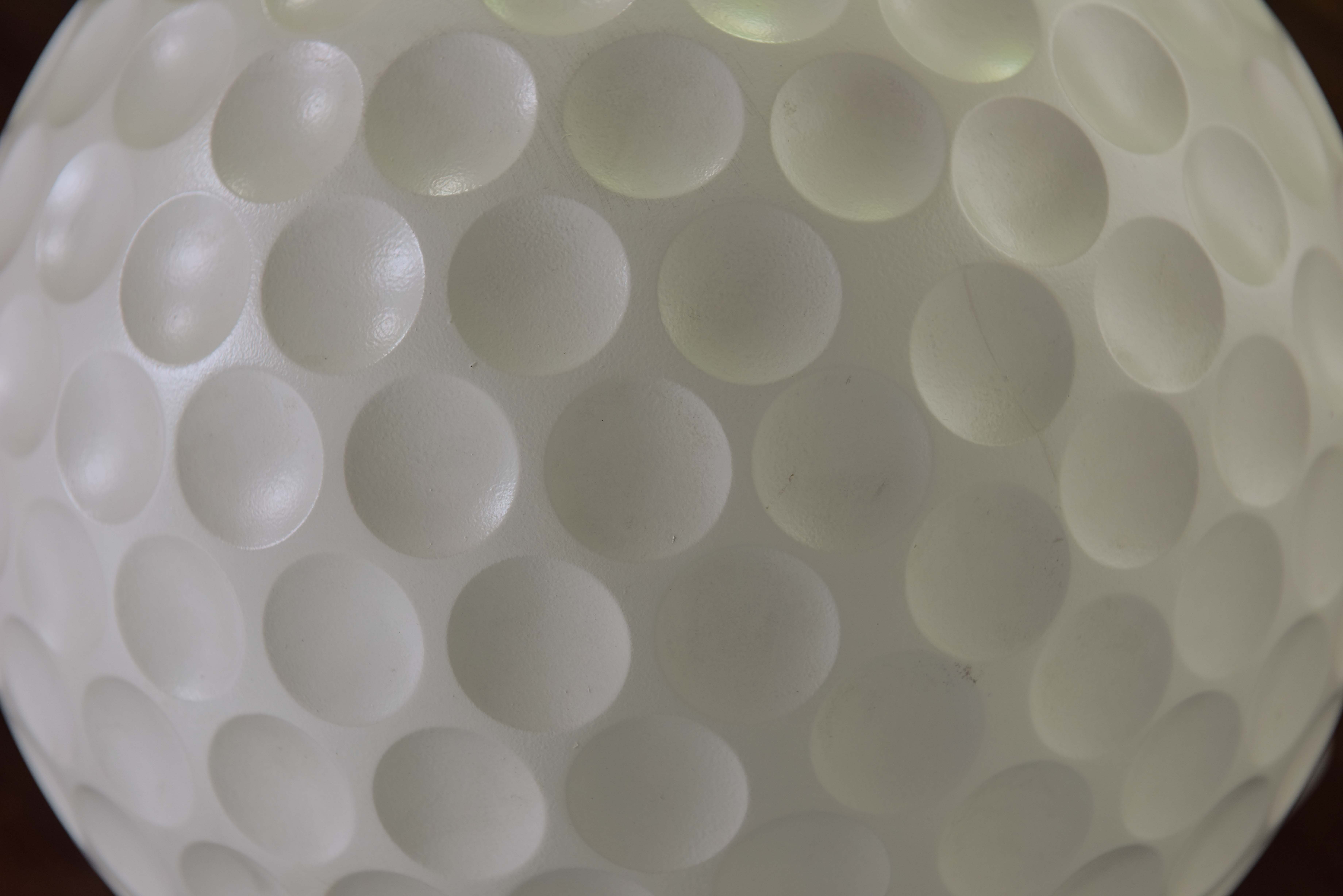 Sedie-Tee seat produced by Gufram in form of a golf ball set on a tee