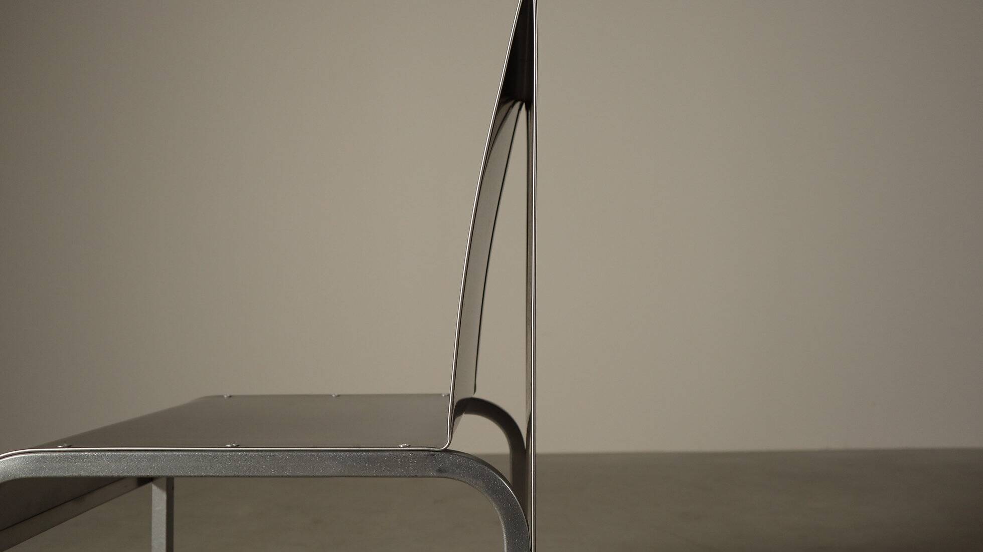 Set of six postmodernist stainless steel dining chairs from circa 1980-1990.