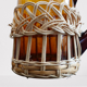 Fruit juice or vintage lemonade service in glass and wicker.
