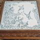 Antique musical trivet made of carved wood and Belle Époque earthenware.