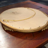 Oval gilt mirror, 30 x 44 cm, with floral decoration, circa 1930