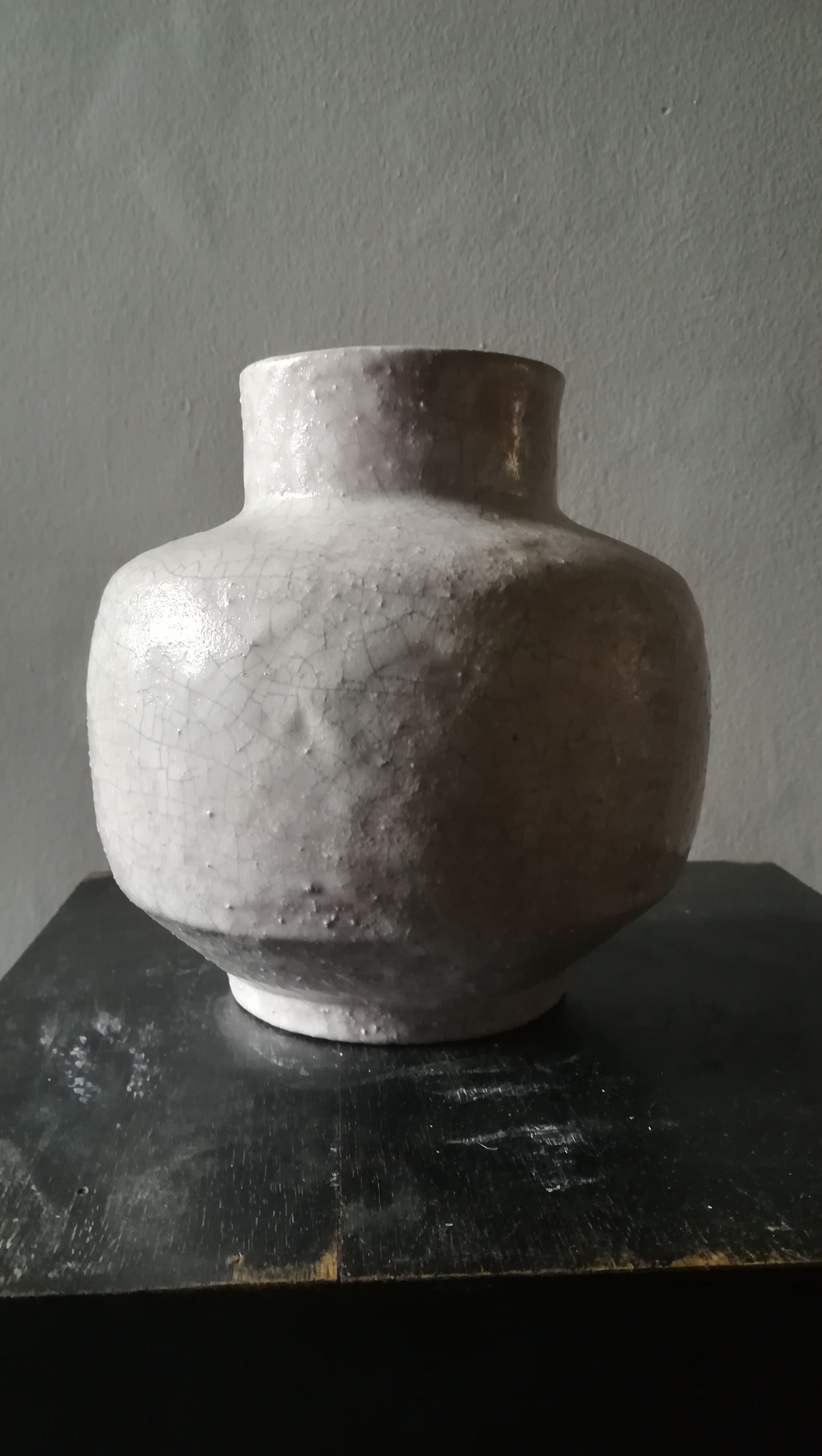 Vase covered white crusty and cracked ceramic,