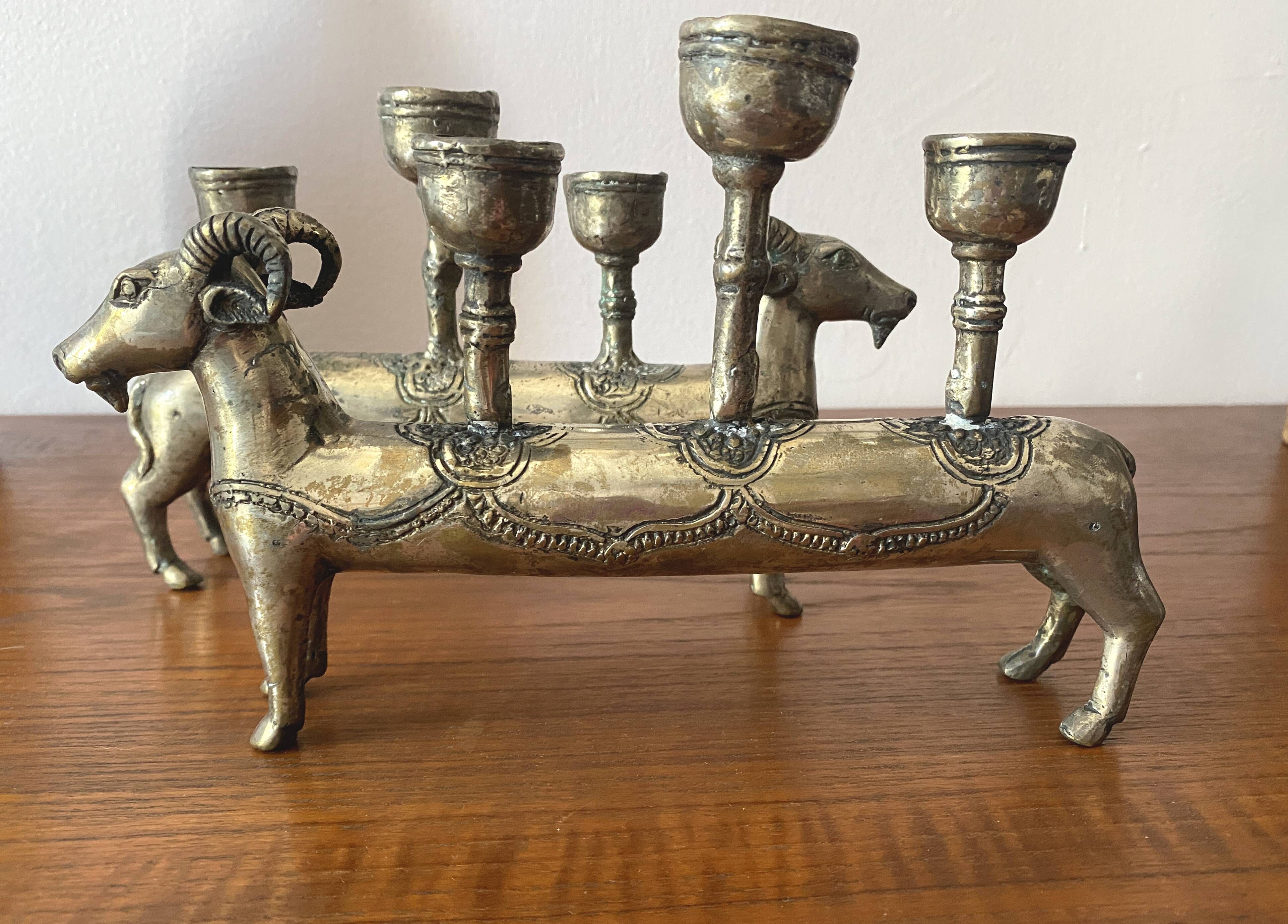 Pair of religious silver-plated zoomorphic candlesticks