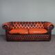 Chesterfield sofa in patinated orange leather, 2.5 seats
