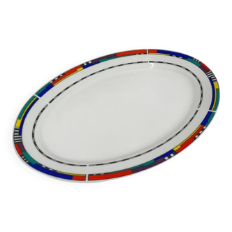Oval porcelain plate by Van Well, multicoloured geometric border, 1980.