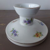 Old candle holder in flowered porcelain