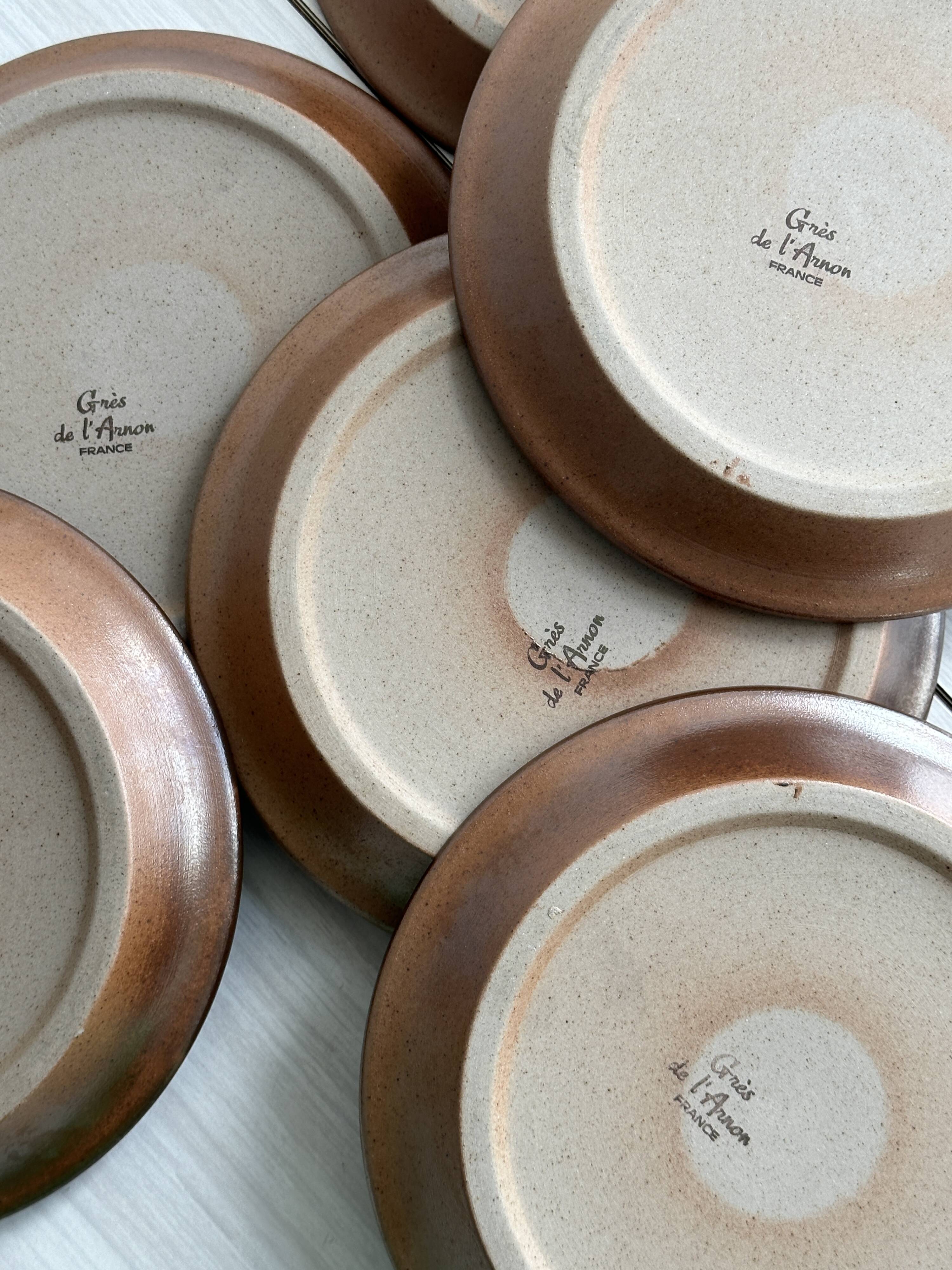 6 Arnon stoneware cheese plates.