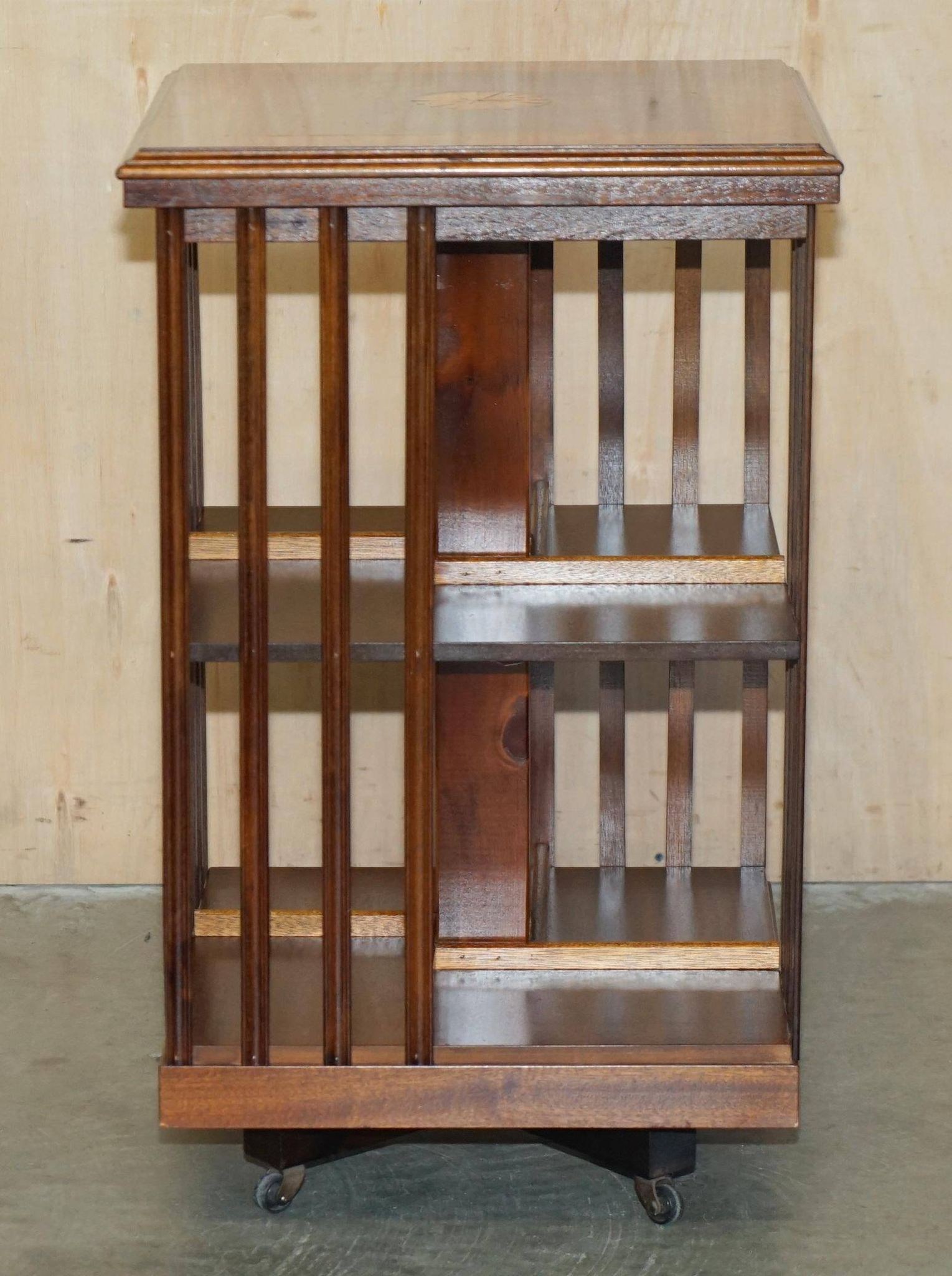 Sheraton Revival rotating library table in walnut and satin wood.