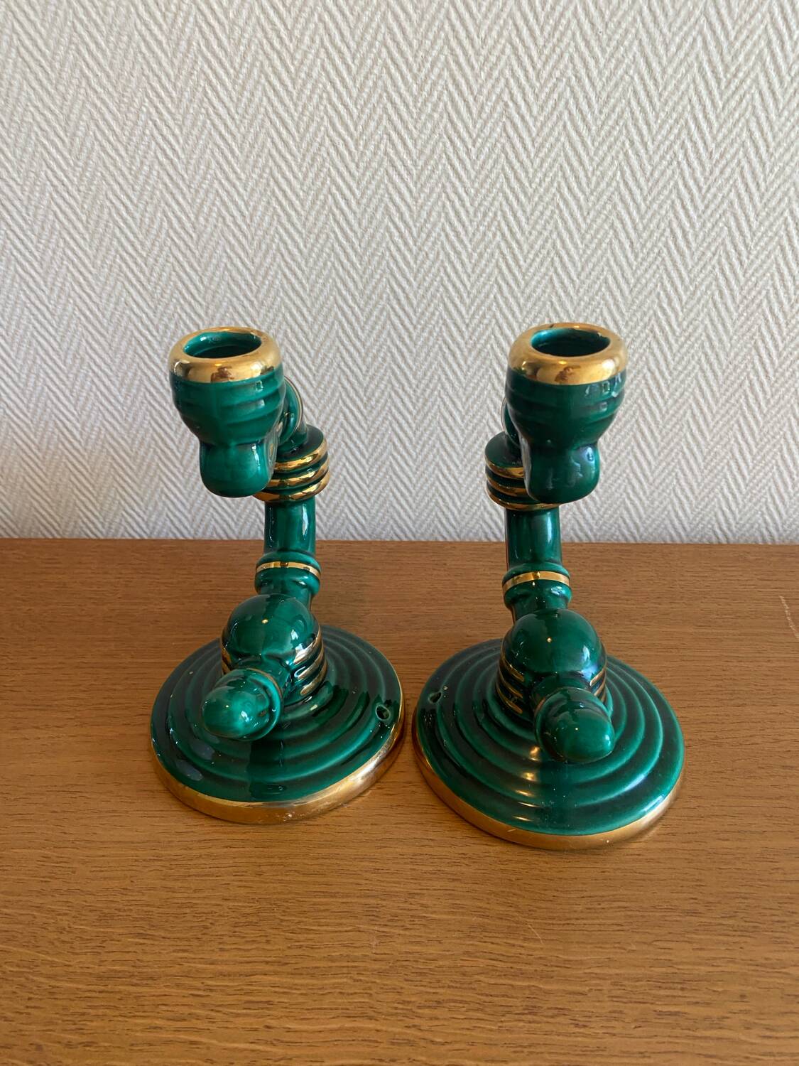 Pair of green and gold ceramic candlesticks