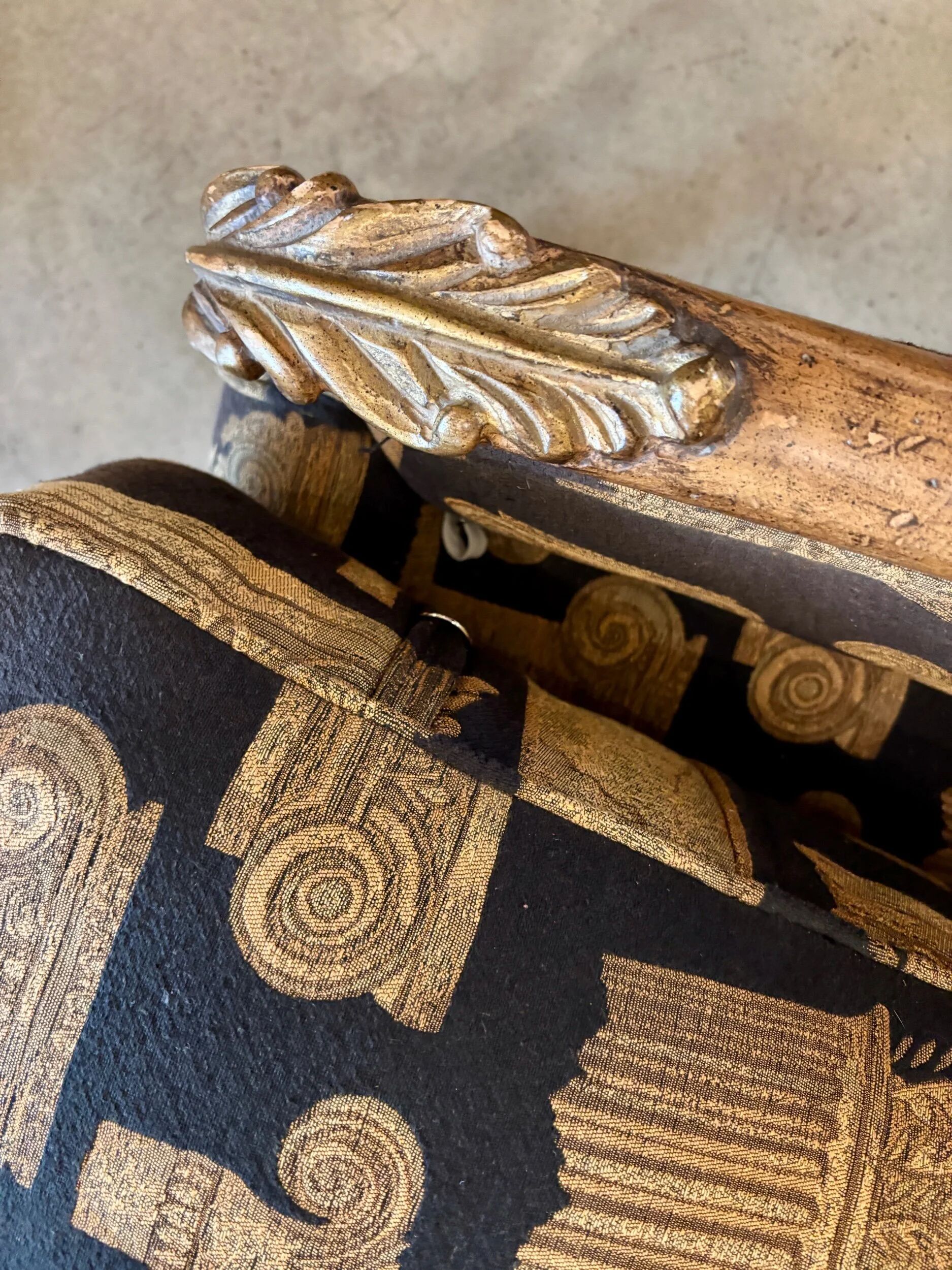 Armchair in a wooden confessional style with black and beige cotton.