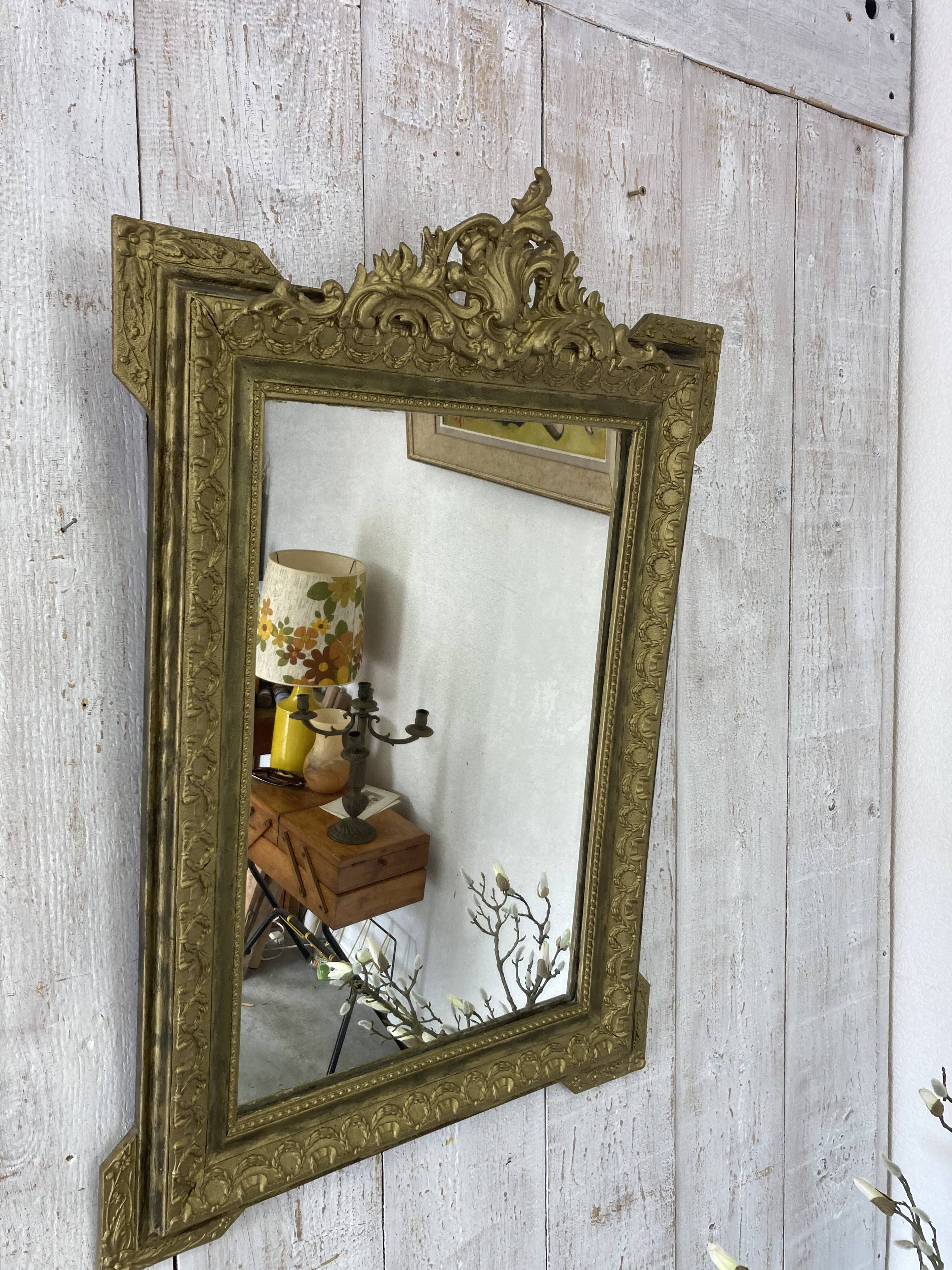 Antique mirror with a pediment