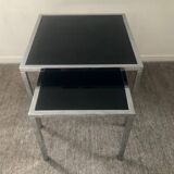 Pair of nesting tables in chromed metal and glass