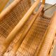 Vintage caramel-colored bamboo and rattan magazine rack