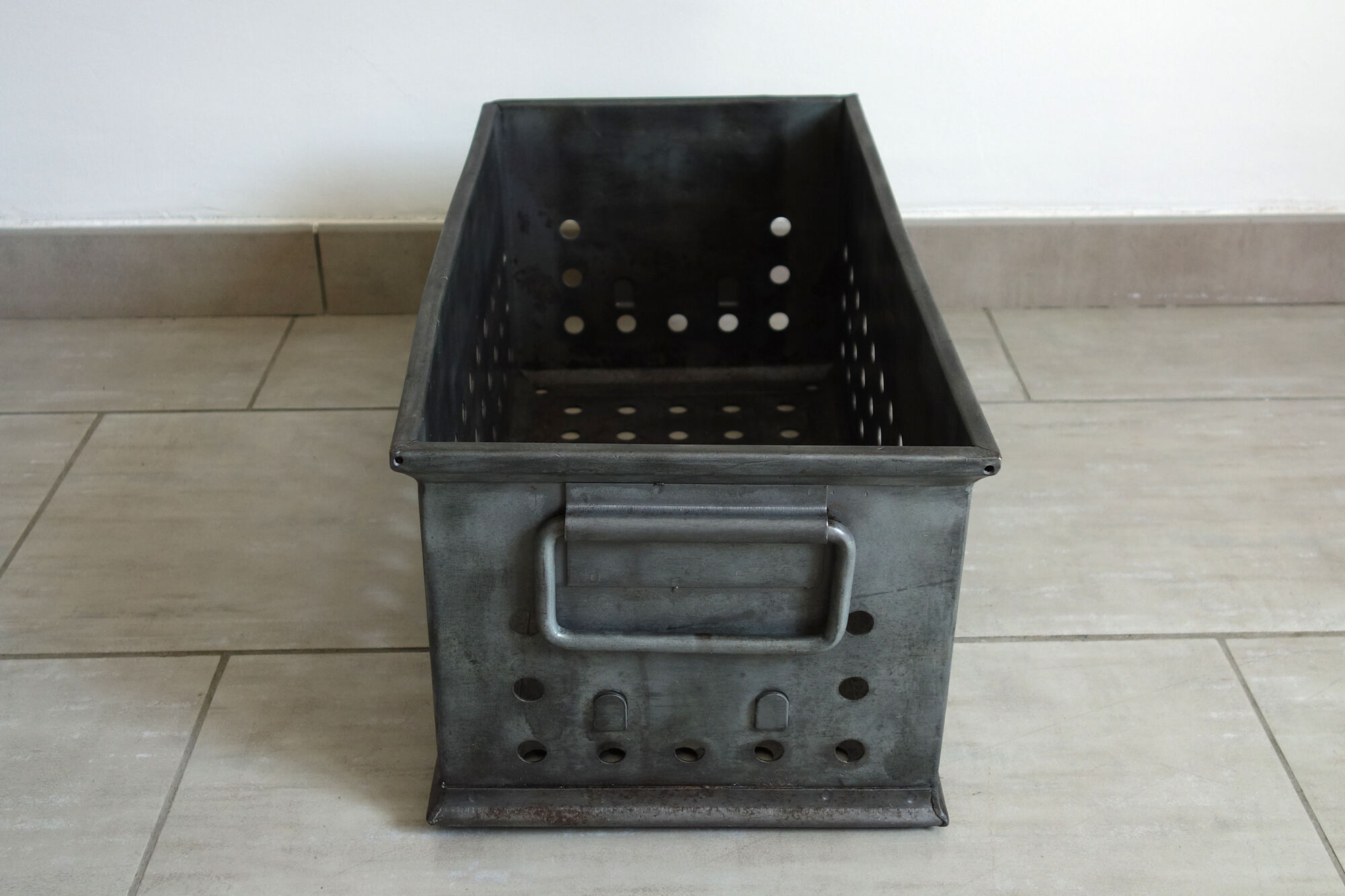 Old industrial box perfoated metal