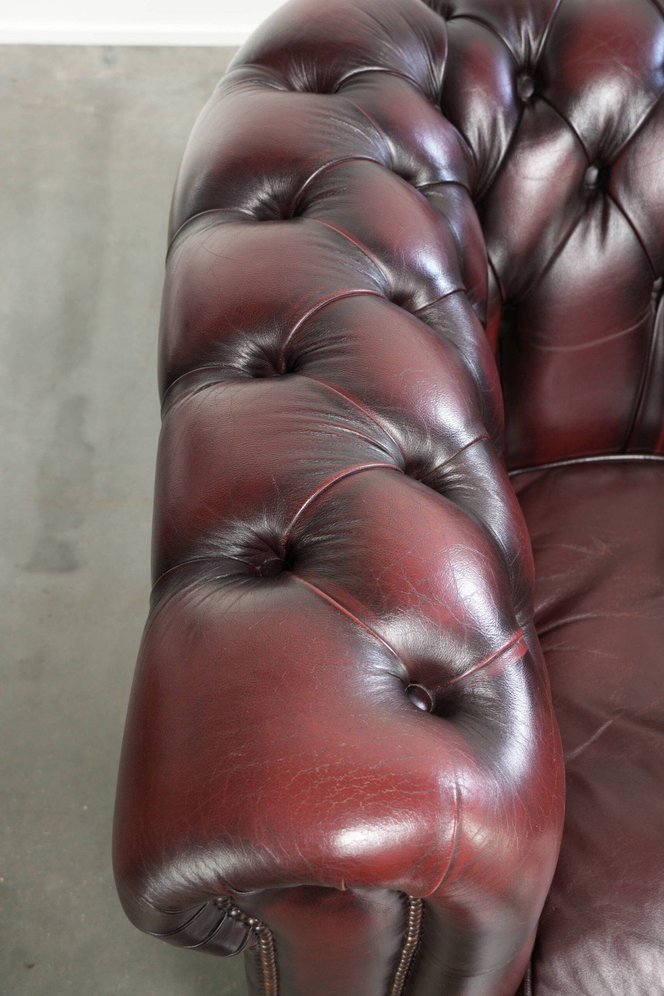 English cowhide Chesterfield club armchair in a beautiful red colour