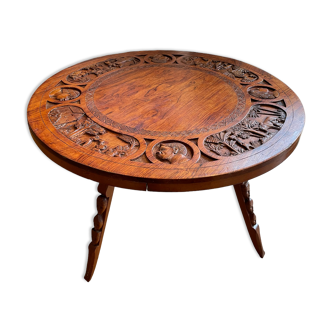 Circular tripod coffee table in carved wood