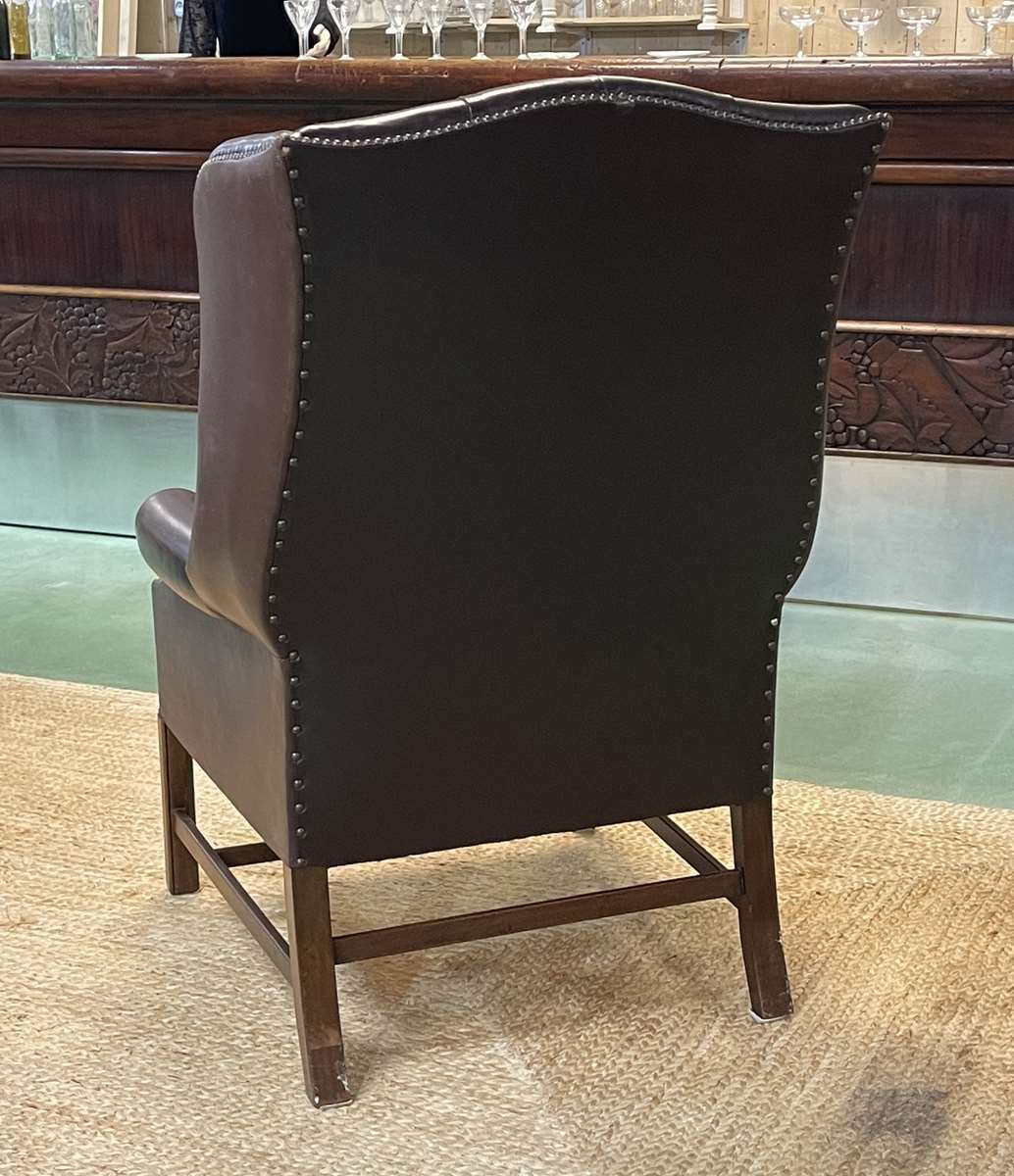 Chesterfield armchair with brown leather ears from the 1990s in very good condition