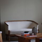 Sculptural 2-seater canapé in oak and wool, Danish "Skønvirke" style, 1920s.