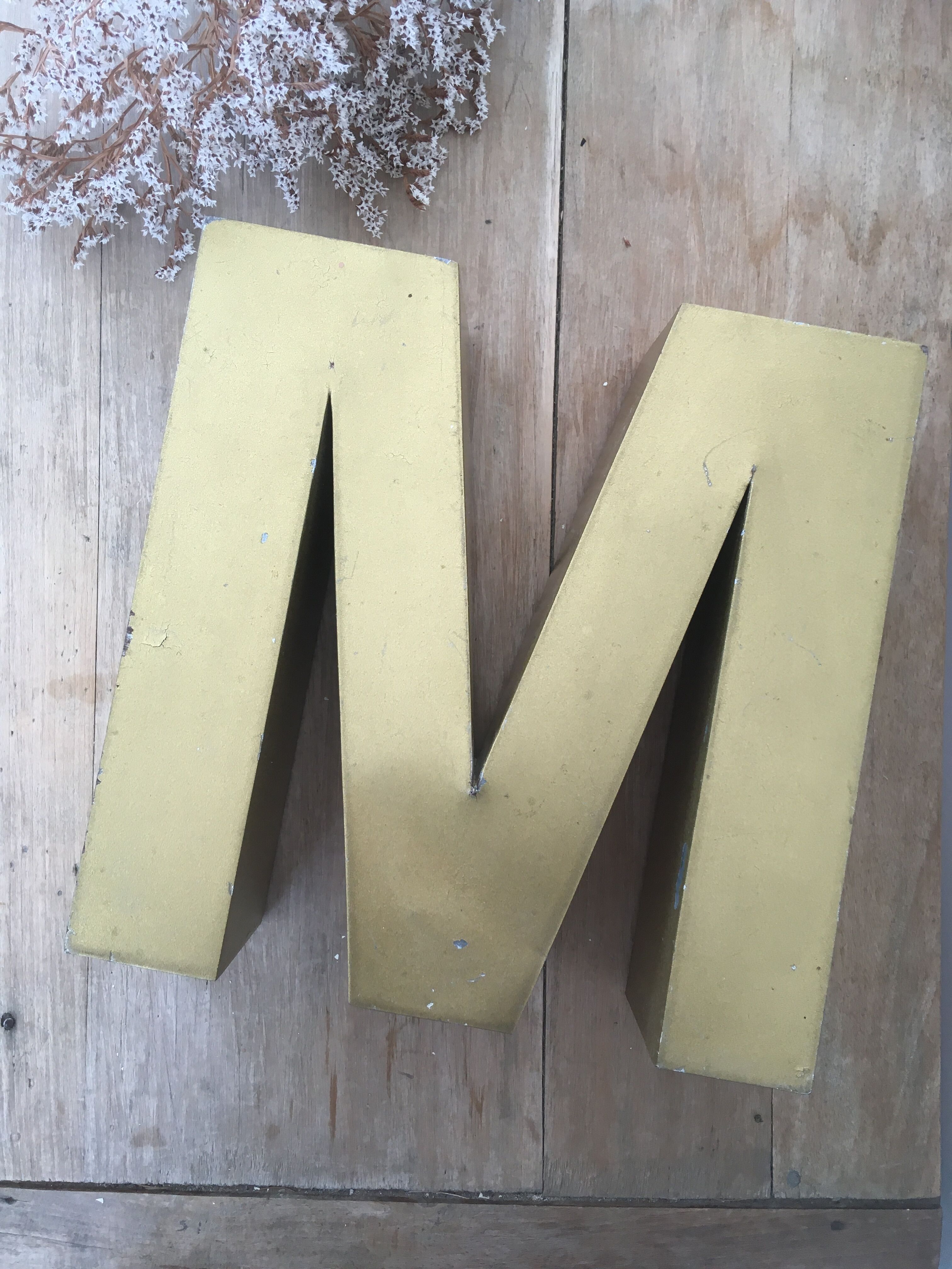 Golden vintage sign letter M