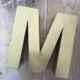 Golden vintage sign letter M