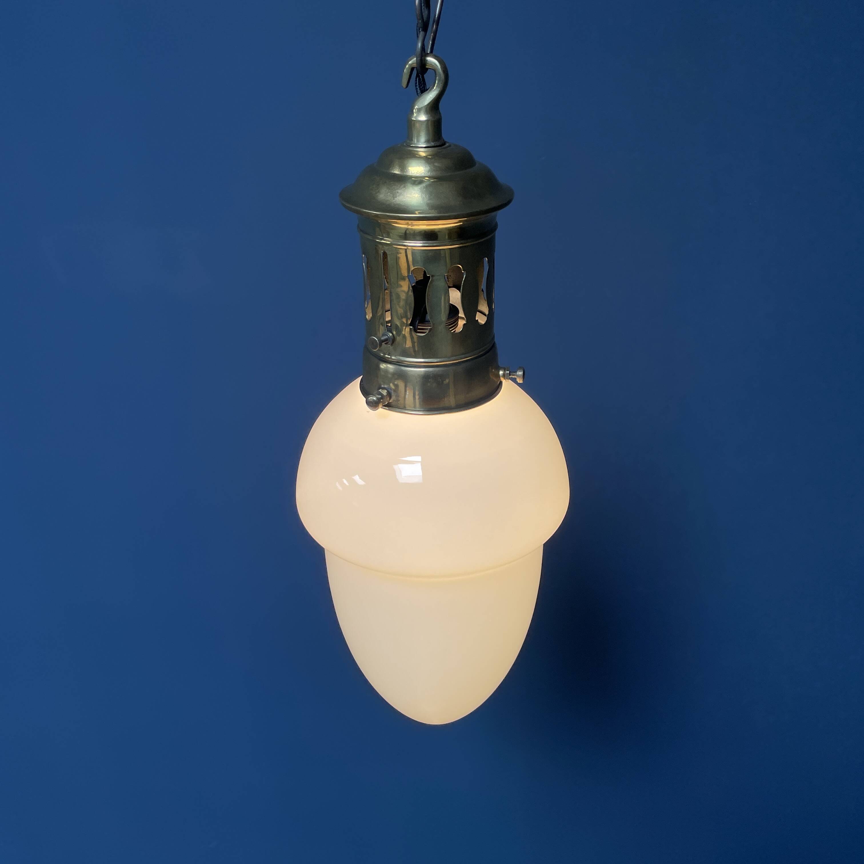 Opaline glass pendant lamp with elegant brass fixture