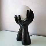 Italian design ceramic table lamp, two hands and glass shade.