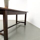 Solid pine workbench, grooved top, satin brown finish.