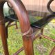 Smoked glass desk on rattan legs and leather detail