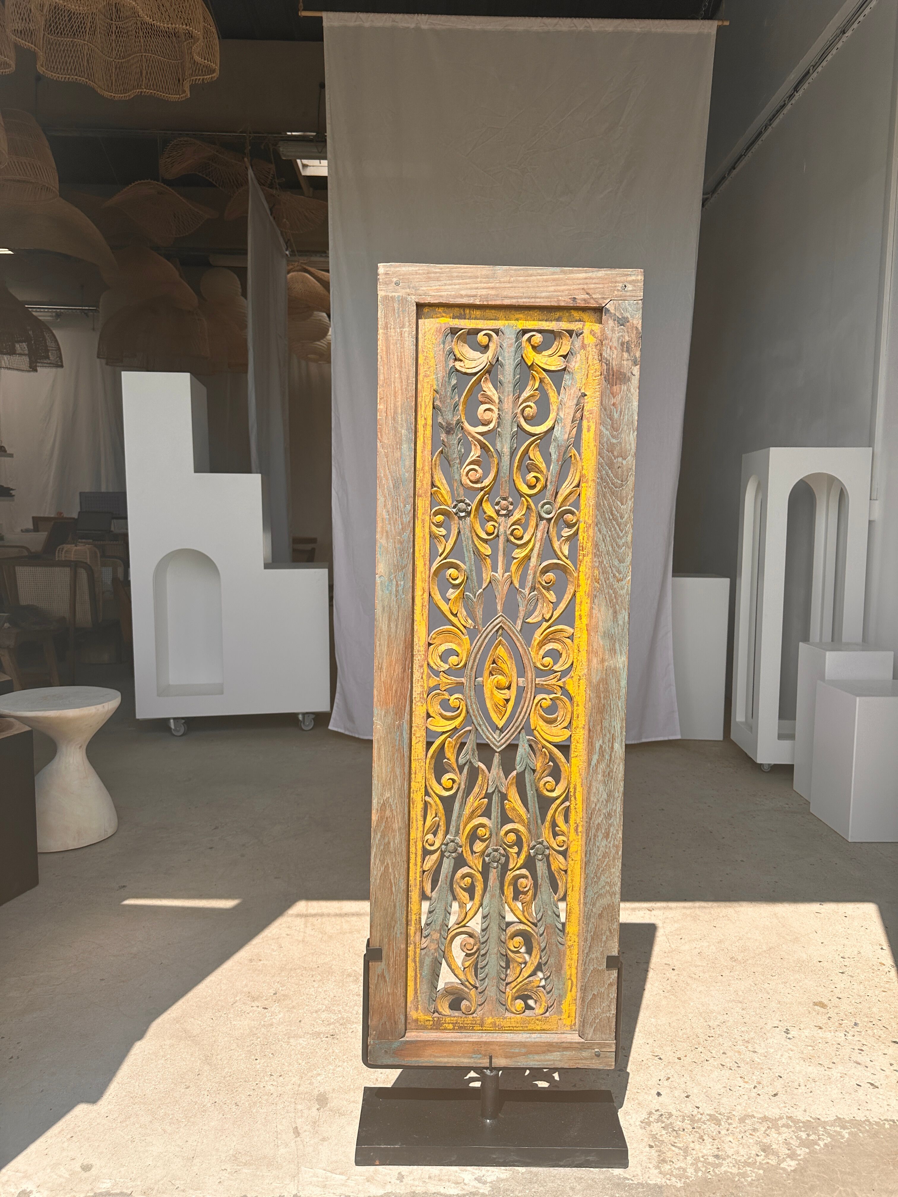 Rectangular Indonesian construction element with blue and yellow plant in carved wood