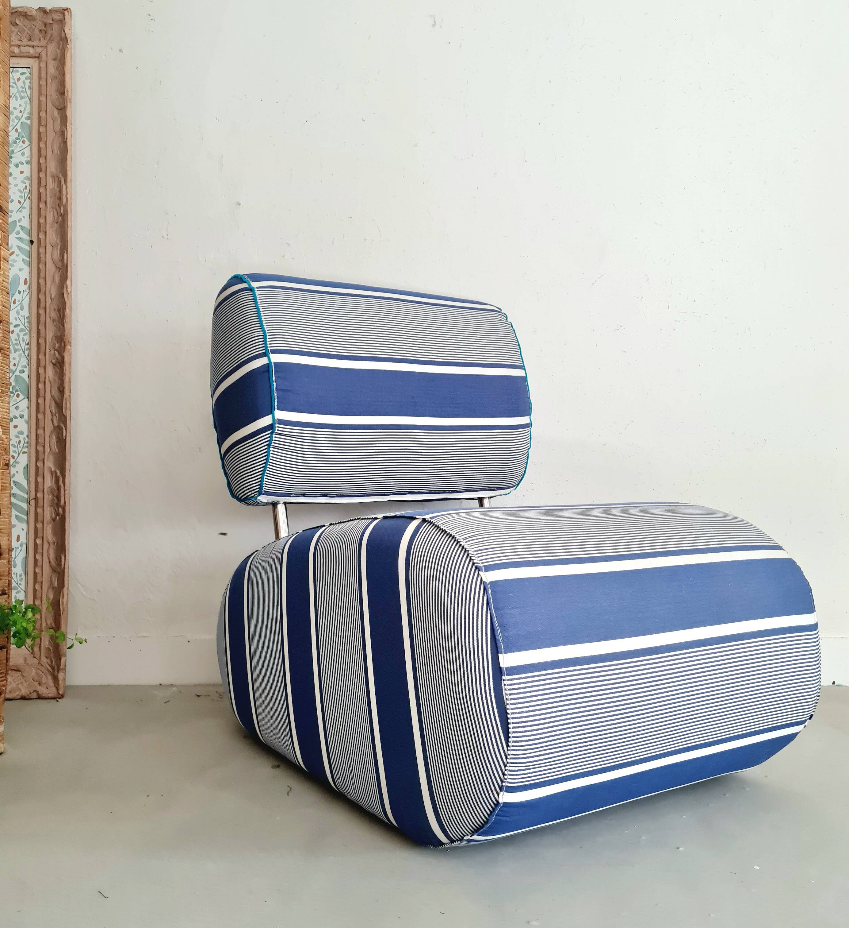Curved armchair with blue and white stripes