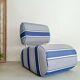Curved armchair with blue and white stripes