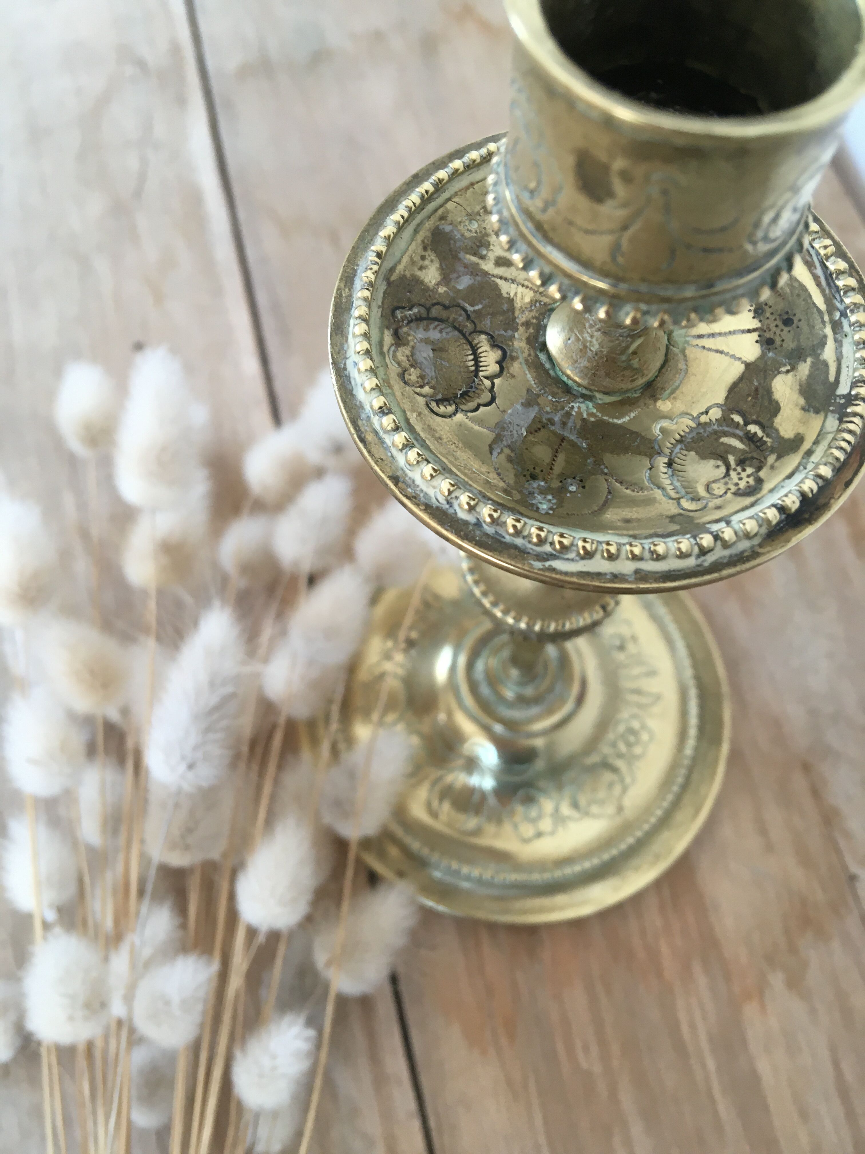 Chiseled brass candle holder