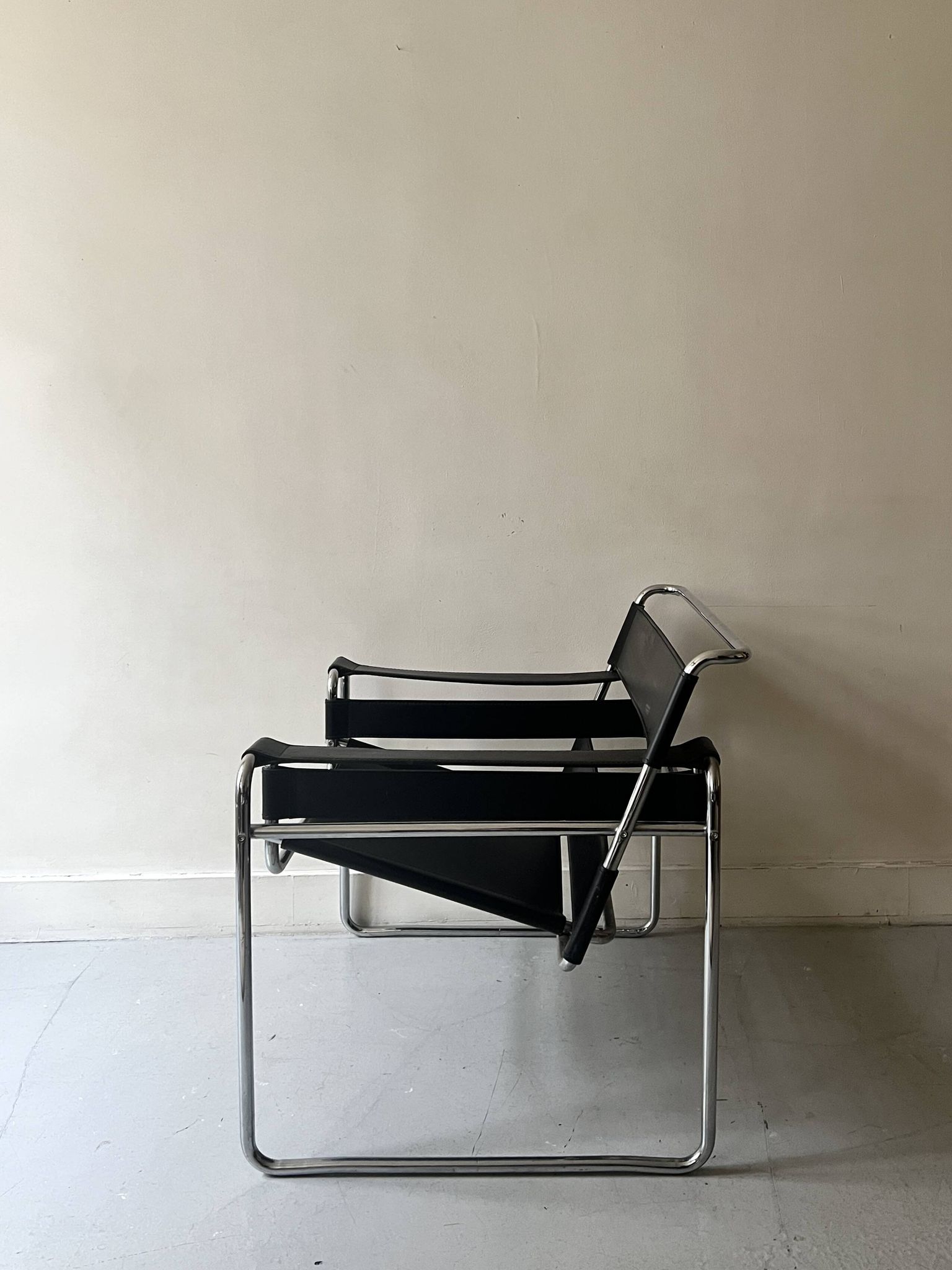 Wassily tubular armchair in chrome & black leather, designed by Marcel Breuer in 1970.