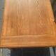 Solid wood coffee table with drawer and original key.